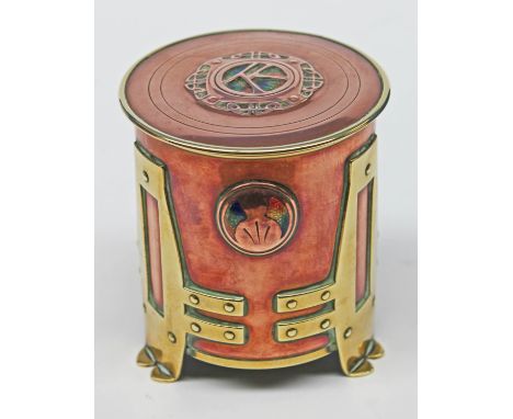 An Arts & Crafts copper, brass and enamel jar circa 1905, attributed to Anne Stubbs for A E Jones, height 10.8cm, diam. 10cm.