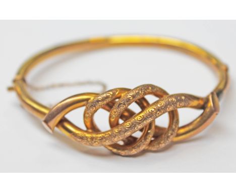 A Victorian/Edwardian 9ct gold bangle, diam. 6.5cm, gross wt. 9.5g.