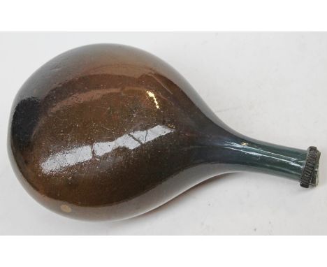 A 17th/18th Century traveller's blue and brown glass flask with ribbed rim, length 26cm.  CONDITION REPORT - nibbles to rim, 