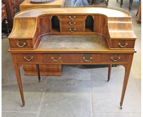 A reproduction mahogany Carlton House desk, early 20th Century, width 121cm, depth 64cm & height 102cm.