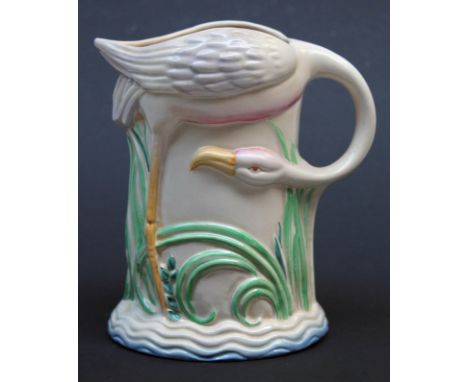 A Clarice Cliff Art Deco pottery jug formed as a flamingo, height 19cm. CONDITION REPORT - good restoration around base.