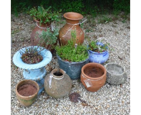A collection of garden pots to include a pair of terracotta glazed urns, a small copper copper etc and a metal shelf unit