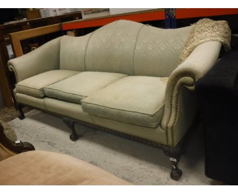 A circa 1900 upholstered scroll arm sofa in the George III taste raised on carved cabriole legs to claw and ball feet 
