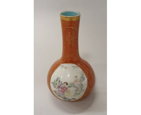 A Chinese republican period gourd shaped vase (1912-1949) oxide red ground with overglaze dragon and scrolling foliage decora