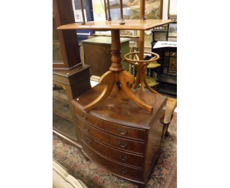 A collection of furniture comprising a bow-front chest of four drawers, an Edwardian mahogany and inlaid single door glazed s