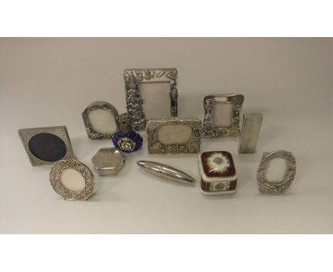 A chrome Dunhill lighter with engine turned decoration, together with two cheroot holders, various modern miniature picture f