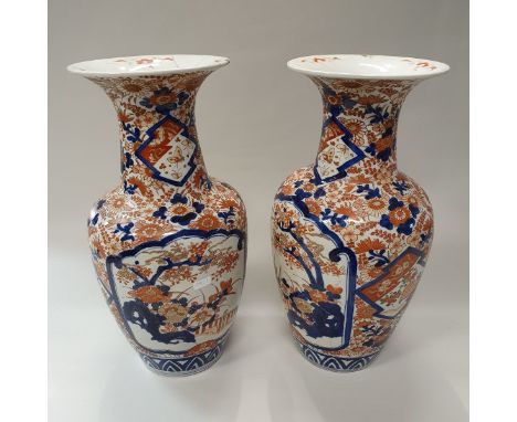 A pair of Japanese Meiji period Imari vases with all over foliate decoration and panels of blossoming trees CONDITION REPORTS