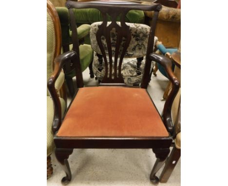 A late 19th Century elbow chair in the Chippendale taste, raised on cabriole legs and bun feet, together with a Victorian but