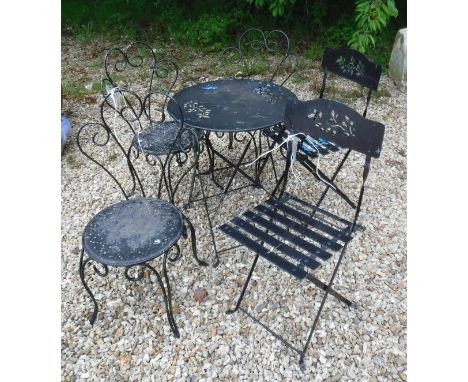 A painted metal garden table together with two folding bistro style chairs and three further chairs 