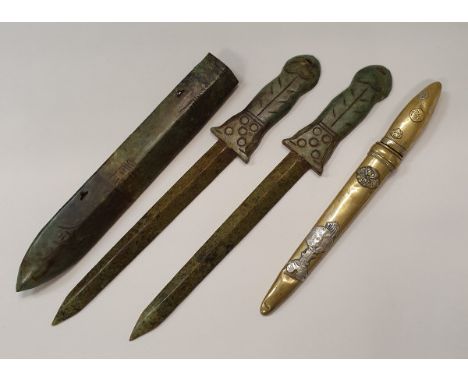 A collection of items comprising a jade dagger, the carved scabbard set with fish motifs and characters revealing twin blades