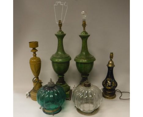 A pair of mottled green painted metal table lamps, a yellow painted Toleware style table lamp, three further table lamps, two