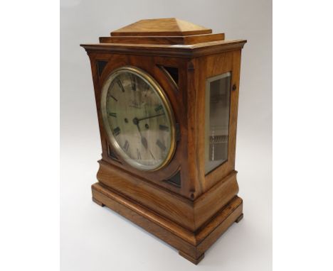 A 19th Century walnut cased mantel clock, the eight day twin fusee movement with silvered dial and Roman numerals inscribed "