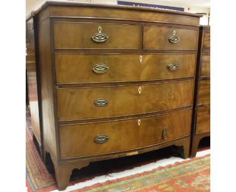 A 19th Century mahogany and satinwood strung bow fronted chest of two short over three long drawers on bracket feet