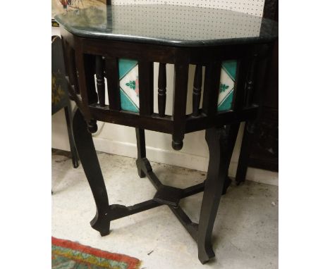 A Zanzibar centre table, the green marble octagonal top over a tile decorated and galleried frieze on four flattened cabriole