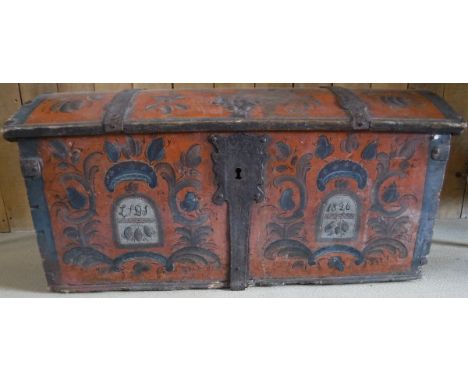 An early 19th Century Continental painted and iron bound dome top trunk with all-over floral and foliate decoration, the fron