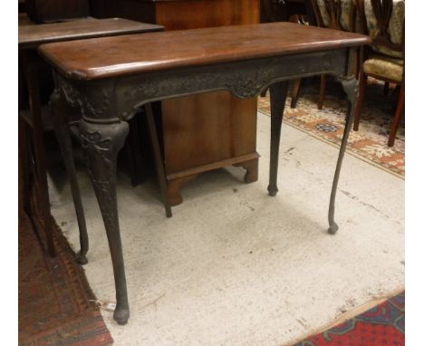 A Victorian cast iron tavern type centre table with swag and bow decoration and mahogany top, together with a gilt framed mir