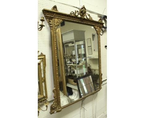 A late Victorian giltwood and gesso framed mantel mirror CONDITION REPORTS 138cm tall 98cm wide Approx