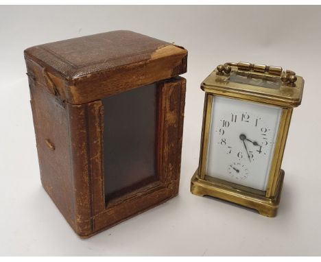 A French brass mantel clock, the white enamelled dial set with Arabic numerals and secondary dial stamped "made in France" to