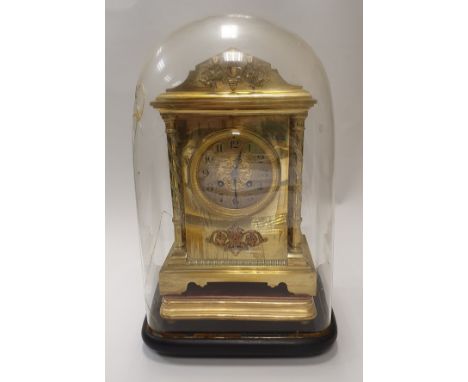A Victorian lacquered brass cased eight day mantel clock under glass dome