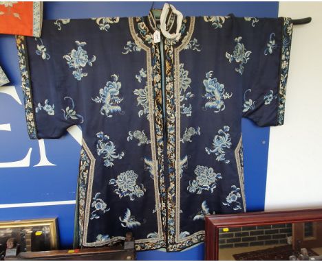 A 19th Century Japanese silk robe, the blue ground with embroidered moth and floral spray decoration, with applied collars, c