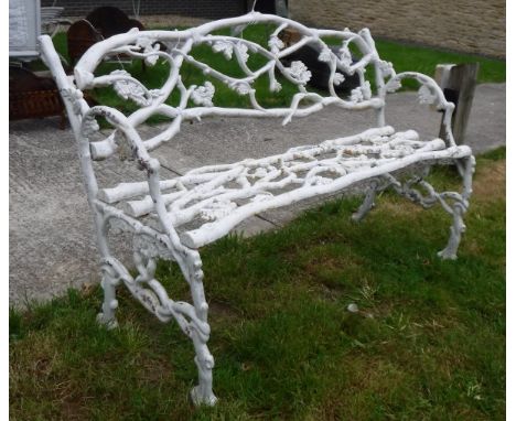 A Coalbrookdale oak leaf and acorn branch design two seat garden bench in the manner of J. Hayward of Derby 