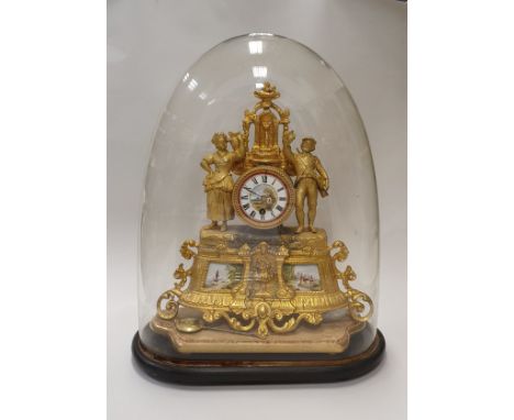 A late 19th Century French gilt metal cased thirty hour mantel clock with figural decoration under an oval glass dome CONDITI