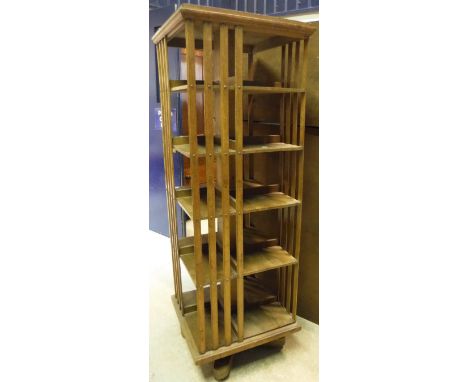 A circa 1900 oak revolving bookcase of five tiers with slatted sides CONDITION REPORTS 174cm height 59cm in width Approx.  Nu