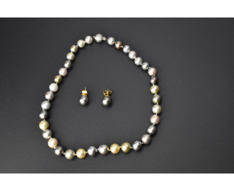 A singe string of Samuel Jones pearl necklace with dark, medium, light grey, pale golden and cream pearls, the clasp bead ins