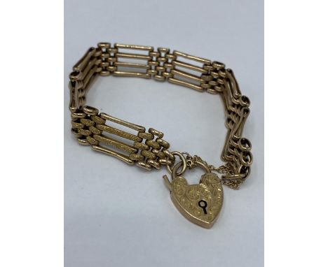 A 9ct gold four bar gate bracelet, with a padlock style clasp, 17.1 grams 