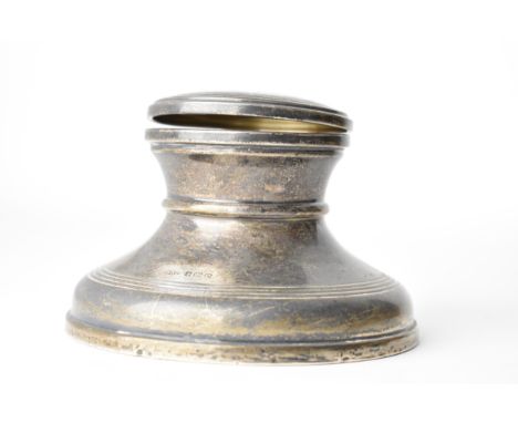A large silver capstan inkwell by B &amp; Co Birmingham 1928, with a hinged lid, enclosing a removable, clear glass liner, 7.
