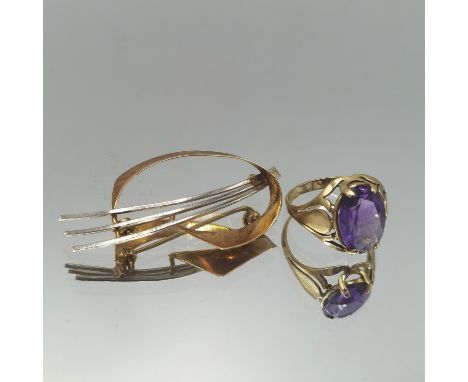 A 14ct gold ring inset with amethyst, size M 1/2. Together with a white and yellow metal, testing as 14ct gold, pin back broo