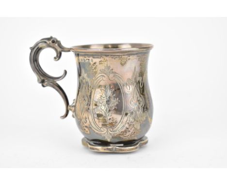 A Victorian silver Christening mug by Henry Wilkinson &amp; Co, Sheffield 1866 with a ribbed rim, scrolled handle and petal s