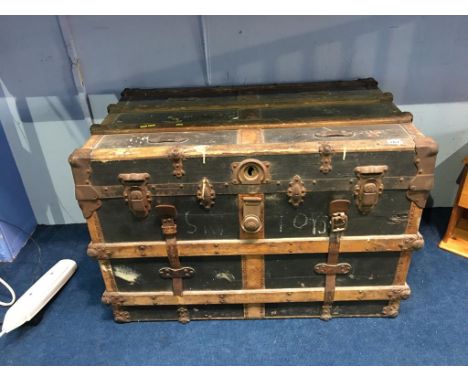 A wood and metal bound steamer trunk