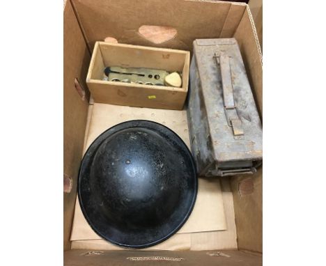 Various brass badges, a button slide and a helmet etc.