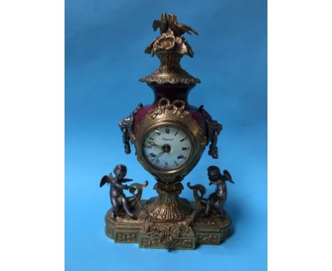 A reproduction brass mounted mantle clock