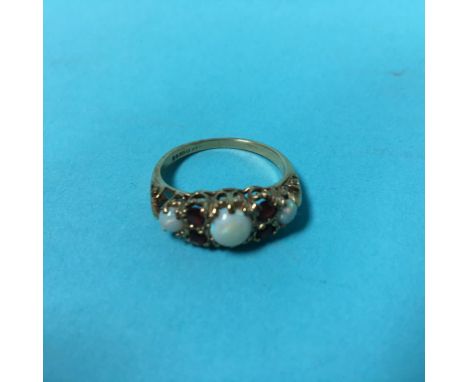 A 9ct opal and garnet ring, 2.7g