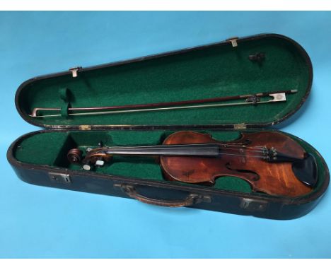 A 19th century violin and bow in fitted hard case, inscribed 'In Silvis Viva Silvi Canora Iam Mortua Cano' to rear, back 38cm