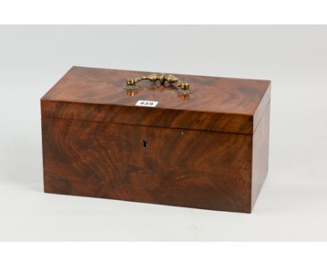 A Regency figured mahogany tea caddy with brass carrying handle, pink velvet lined interior with two lidded wooden tea boxes 