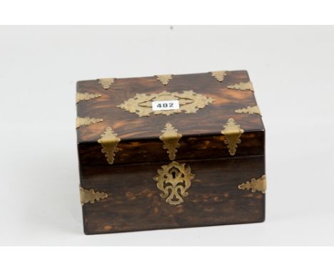 A Victorian rosewood tea caddy with numerous brass edge mounts, central pierced lid cartouche and escutcheon, twin interior l