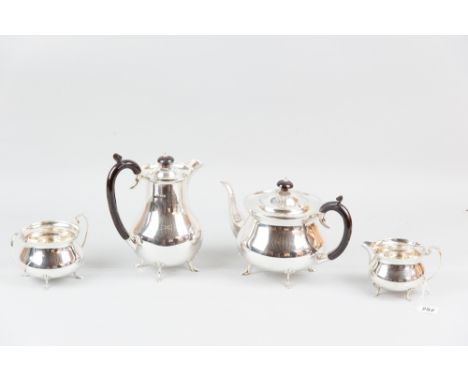 A four piece silver tea and coffee service, each piece of circular plain form and with four shell and web supports, 48 ozs gr