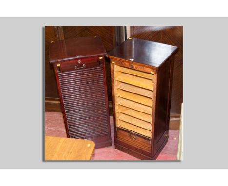 A good pair of late 19th Century stained oak tambour fronted music cabinets, each with nine light wood sliding open front dra