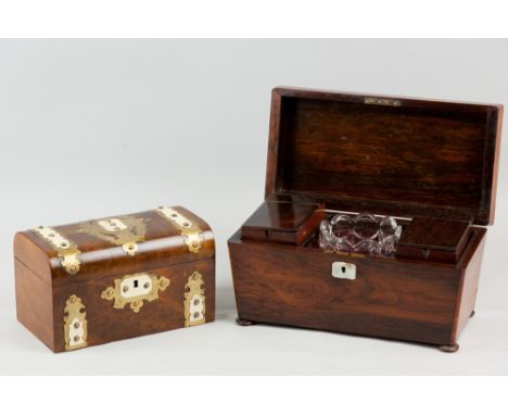 A 19th Century rosewood sarcophagus shaped tea caddy on bun feet, the interior with lift-out lidded tea boxes with central gl