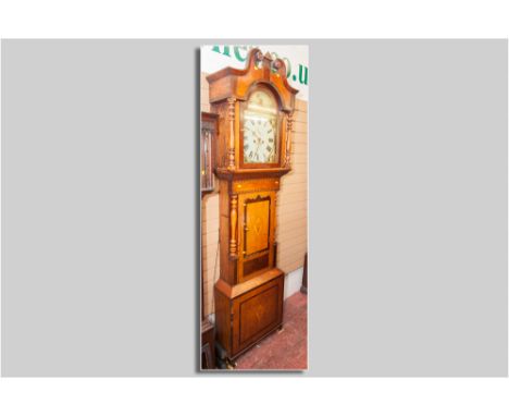 A Victorian oak and mahogany longcase clock with 14 ins painted arched top dial, Roman numerals with subsidiary seconds dial 