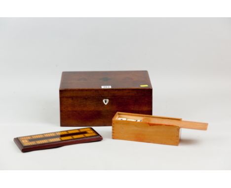A late 19th Century oak box with heart shaped mother of pearl escutcheon, the lid inlaid with various woods for playing card 