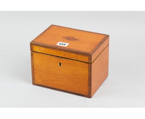 A 19th Century satinwood tea caddy with walnut and boxwood crossbanding, ebonized and boxwood interior with possibly later ma