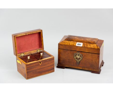 A Victorian walnut tea caddy with pierced decorative escutcheon, twin lidded interiors with brass knobs standing on corner br