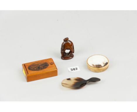 A horn round lidded box, a horn caddy spoon, a mauchline ware type box and a carved oriental netsuke of a horse
