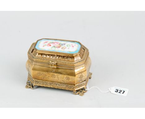 A late nineteenth century French gilt metal casket surmounted with a hand painted Sevres style plaque, painted with floral sp