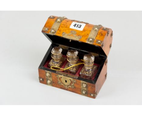 A walnut dome topped scent bottle casket with chased brass strap and button banding, pierced brass escutcheon and top plate, 