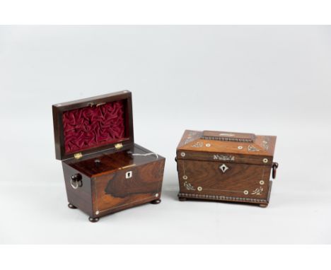 A Victorian rosewood and mother of pearl inlaid sarcophagus shaped tea caddy with carved wooden ring carry handles standing o